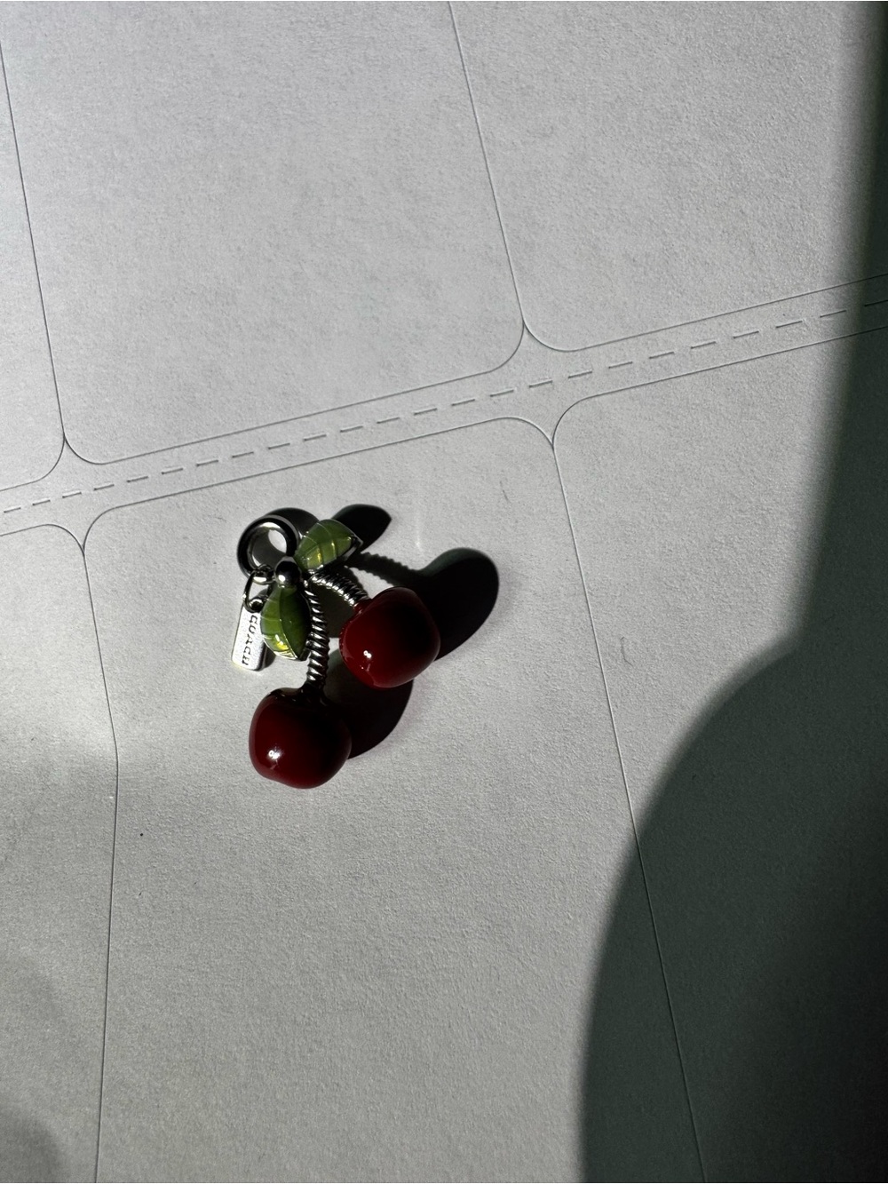 Coach Cherry Charm Pendant with Green Leaves and mini coach hangtag